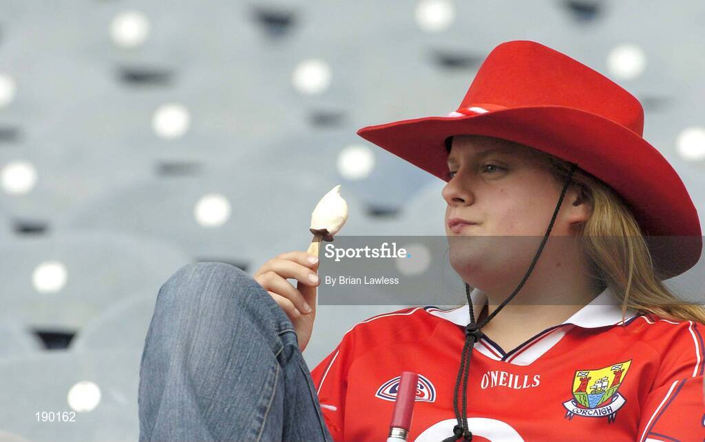 18 September 2005; A Cork fan enjoys an ice cream during the match. Tipperary v Cork, All-Ireland Senior Camogie Final, Croke Park, Dublin. Picture credit; Brian Lawless / SPORTSFILE