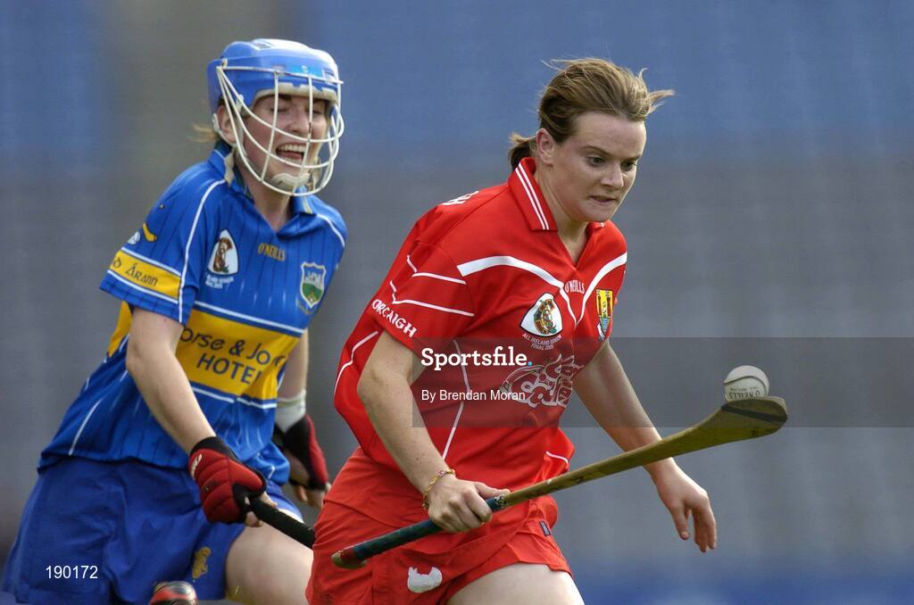 18 September 2005; Briege Corkery, Cork, races clear of Philly Fogarty, Tipperary, on her way to scoring a late point. Tipperary v Cork, Foras na Gaeilge All-Ireland Senior Camogie Final, Croke Park, Dublin. Picture credit; Brendan Moran / SPORTSFILE