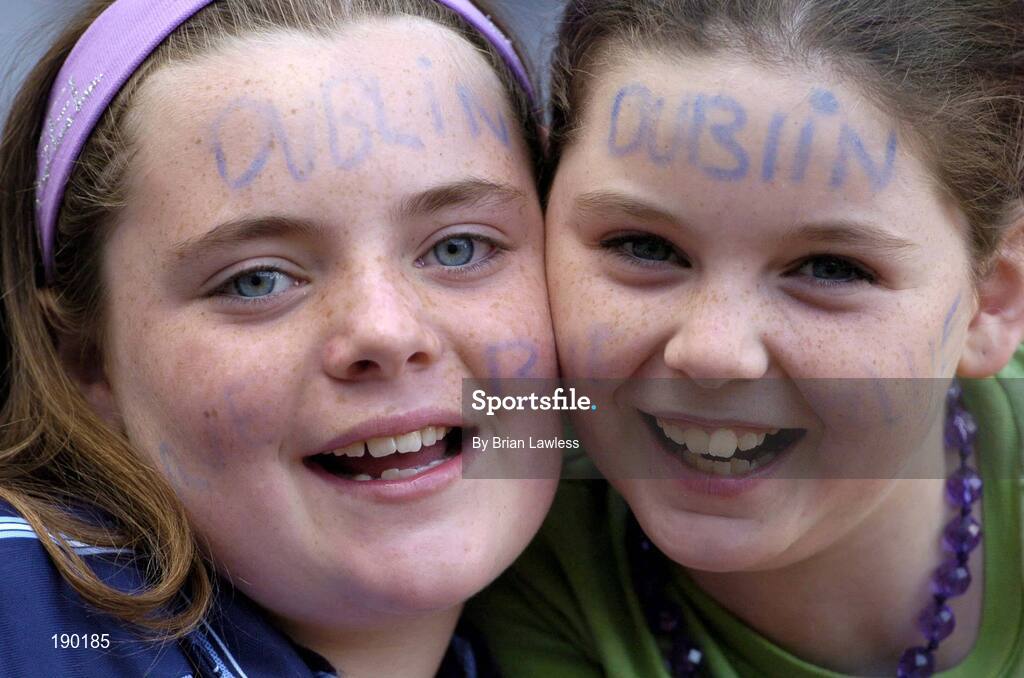 18 September 2005; Dublin fans Amy Galligan, aged 10, with Erica Donnelly, aged 10, right, both from Swords, show their support. Dublin v Clare, All-Ireland Junior Camogie Final, Croke Park, Dublin. Picture credit; Brian Lawless / SPORTSFILE *** Local Caption *** Any photograph taken by SPORTSFILE during, or in connection with, the 2005 Guinness All-Ireland Hurling Final which displays GAA logos or contains an image or part of an image of any GAA intellectual property, or, which contains images of a GAA player/players in their playing uniforms, may only be used for editorial and non-advertising purposes.  Use of photographs for advertising, as posters or for purchase separately is strictly prohibited unless prior written approval has been obtained from the Gaelic Athletic Association.