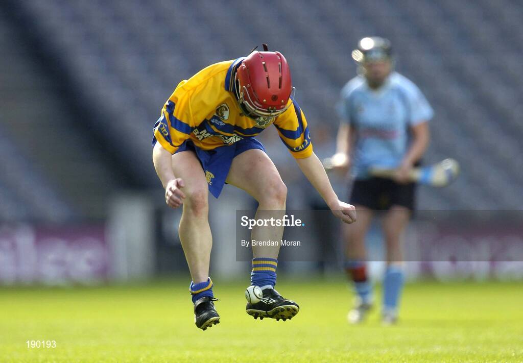 18 September 2005; Deirdre Murphy, Clare, raises the sliothar off the ground with her feet. Dublin v Clare, All-Ireland Junior Camogie Final, Croke Park, Dublin. Picture credit; Brendan Moran / SPORTSFILE *** Local Caption *** Any photograph taken by SPORTSFILE during, or in connection with, the 2005 Guinness All-Ireland Hurling Final which displays GAA logos or contains an image or part of an image of any GAA intellectual property, or, which contains images of a GAA player/players in their playing uniforms, may only be used for editorial and non-advertising purposes.  Use of photographs for advertising, as posters or for purchase separately is strictly prohibited unless prior written approval has been obtained from the Gaelic Athletic Association.