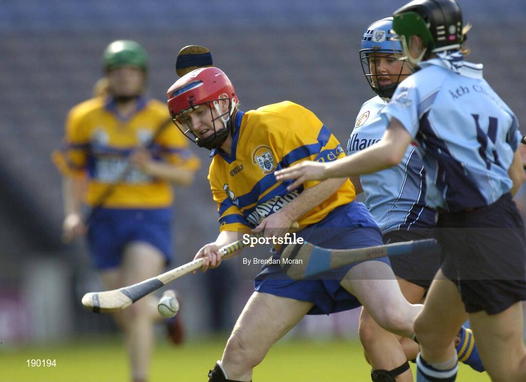 18 September 2005; Cathy Halley, Clare, is tackled by Gillian McCluskey, Dublin. Dublin v Clare, All-Ireland Junior Camogie Final, Croke Park, Dublin. Picture credit; Brendan Moran / SPORTSFILE *** Local Caption *** Any photograph taken by SPORTSFILE during, or in connection with, the 2005 Guinness All-Ireland Hurling Final which displays GAA logos or contains an image or part of an image of any GAA intellectual property, or, which contains images of a GAA player/players in their playing uniforms, may only be used for editorial and non-advertising purposes.  Use of photographs for advertising, as posters or for purchase separately is strictly prohibited unless prior written approval has been obtained from the Gaelic Athletic Association.