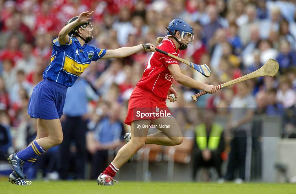 18 September 2005; Emer Dillon, Cork, is tackled by Sinead Nealon, Tipperary. Tipperary v Cork, Foras na Gaeilge All-Ireland Senior Camogie Final, Croke Park, Dublin. Picture credit; Brendan Moran / SPORTSFILE
