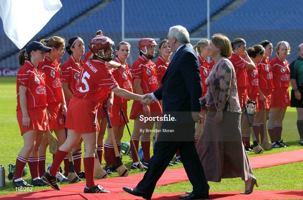 18 September 2005; An Taoiseach Bertie Ahern TD, is met by Cork captain Elaine Burke, in the company of Miriam O'Callaghan, President, Cumann Camogaiochta na NGael. Tipperary v Cork, Foras na Gaeilge All-Ireland Senior Camogie Final, Croke Park, Dublin. Picture credit; Brendan Moran / SPORTSFILE