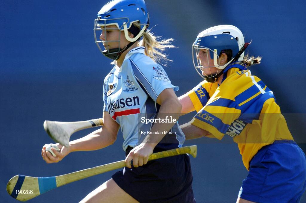 18 September 2005; Aoife Cullen, Dublin, is tackled by Claire McMahon, Clare. Dublin v Clare, All-Ireland Junior Camogie Final, Croke Park, Dublin. Picture credit; Brendan Moran / SPORTSFILE *** Local Caption *** Any photograph taken by SPORTSFILE during, or in connection with, the 2005 Guinness All-Ireland Hurling Final which displays GAA logos or contains an image or part of an image of any GAA intellectual property, or, which contains images of a GAA player/players in their playing uniforms, may only be used for editorial and non-advertising purposes.  Use of photographs for advertising, as posters or for purchase separately is strictly prohibited unless prior written approval has been obtained from the Gaelic Athletic Association.