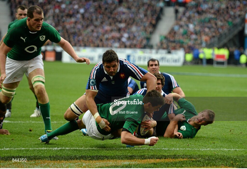 15 March 2014; Jonathan Sexton, Ireland, drives for the line to score his side's first try despite the tackle by Damien Chouly, France. RBS Six Nations Rugby Championship 2014, France v Ireland, Stade De France, Saint Denis, Paris, France. Picture credit: Matt Browne / SPORTSFILE