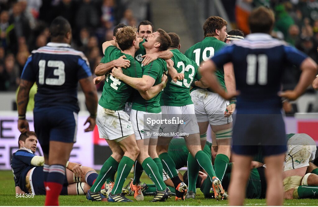 15 March 2014; Brian O'Driscoll, Ireland, celebrates with team-mate Andrew Trimble at the final whistle. RBS Six Nations Rugby Championship 2014, France v Ireland. Stade De France, Saint Denis, Paris, France. Picture credit: Stephen McCarthy / SPORTSFILE