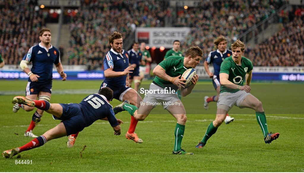 15 March 2014; Brian O'Driscoll, Ireland, evades the tackle of Brice Dulin, France. RBS Six Nations Rugby Championship 2014, France v Ireland. Stade De France, Saint Denis, Paris, France. Picture credit: Stephen McCarthy / SPORTSFILE