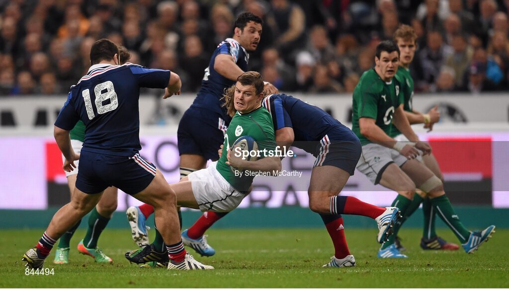 15 March 2014; Brian O'Driscoll, Ireland, is tackled by Dimitri Szarzewski, France. RBS Six Nations Rugby Championship 2014, France v Ireland. Stade De France, Saint Denis, Paris, France. Picture credit: Stephen McCarthy / SPORTSFILE