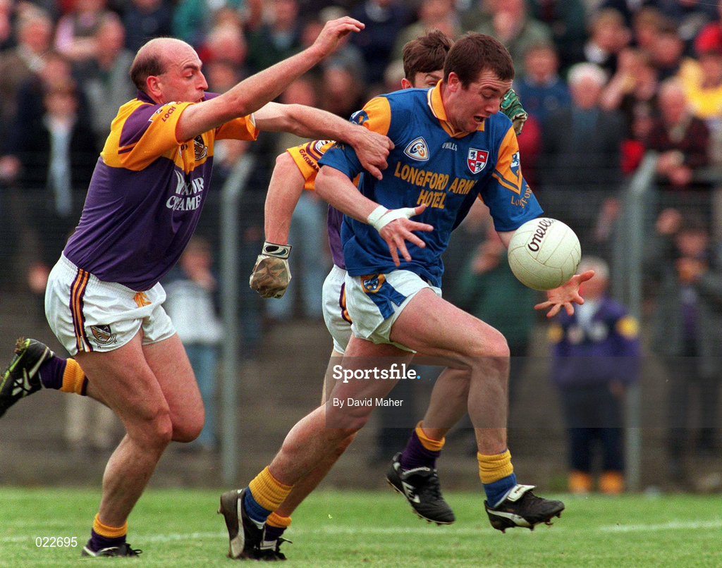 16 May 1999; Edna Barden of Longford in action against John Harrington, left, and Ollie Kinlough, both of Wexford during the Bank of Ireland Leinster Senior Football Championship Preliminary Round Replay match between Longford and Wexford at Pearse Park in Longford. Photo by David Maher/Sportsfile