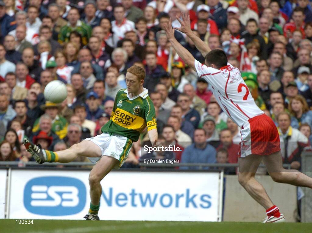 25 September 2005; Colm Cooper, Kerry, in action against Ryan McMenamin, Tyrone. Bank of Ireland All-Ireland Senior Football Championship Final, Kerry v Tyrone, Croke Park, Dublin. Picture credit; Damien Eagers/ SPORTSFILE *** Local Caption *** Any photograph taken by SPORTSFILE during, or in connection with, the 2005 Bank of Ireland All-Ireland Senior Football Final which displays GAA logos or contains an image or part of an image of any GAA intellectual property, or, which contains images of a GAA player/players in their playing uniforms, may only be used for editorial and non-advertising purposes.  Use of photographs for advertising, as posters or for purchase separately is strictly prohibited unless prior written approval has been obtained from the Gaelic Athletic Association.