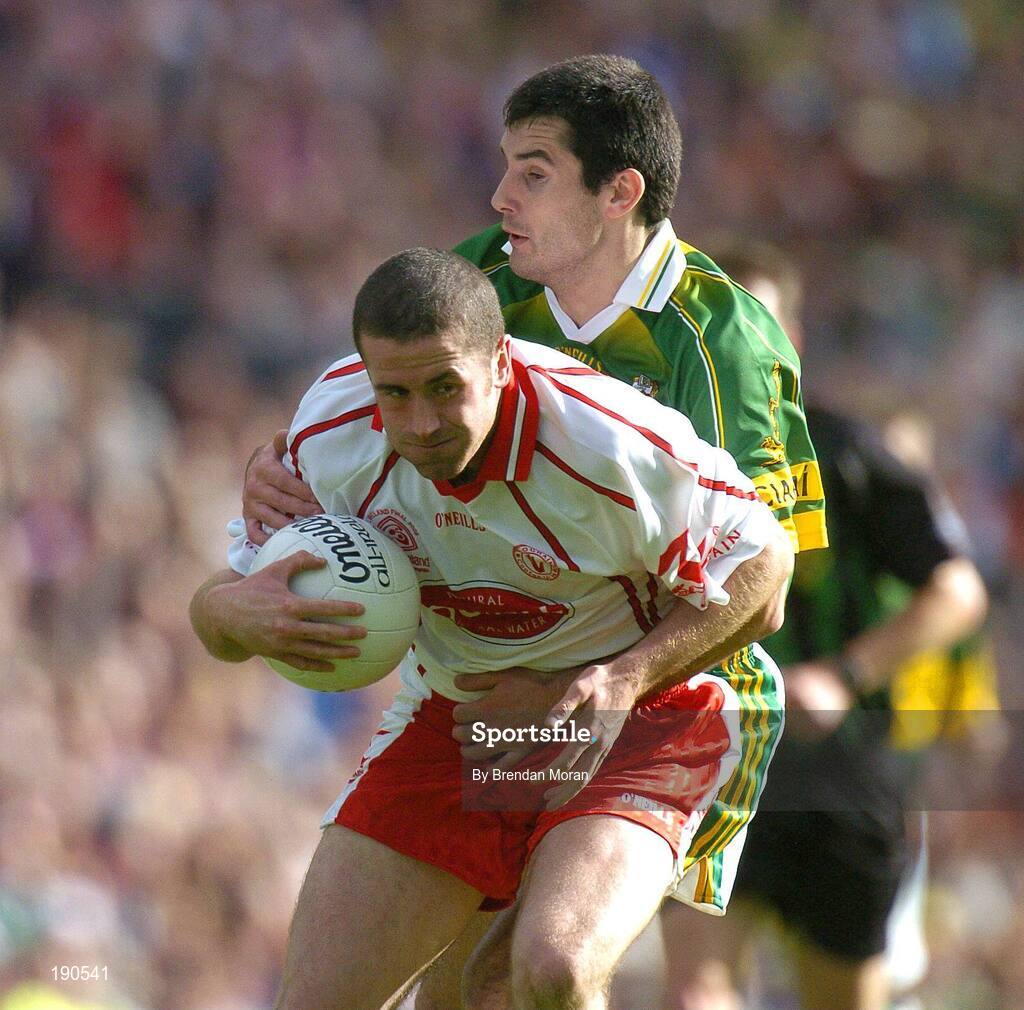 25 September 2005; Stephen O'Neill, Tyrone, in action against Tom O'Sullivan, Kerry. Bank of Ireland All-Ireland Senior Football Championship Final, Kerry v Tyrone, Croke Park, Dublin. Picture credit; Brendan Moran / SPORTSFILE *** Local Caption *** Any photograph taken by SPORTSFILE during, or in connection with, the 2005 Bank of Ireland All-Ireland Senior Football Final which displays GAA logos or contains an image or part of an image of any GAA intellectual property, or, which contains images of a GAA player/players in their playing uniforms, may only be used for editorial and non-advertising purposes.  Use of photographs for advertising, as posters or for purchase separately is strictly prohibited unless prior written approval has been obtained from the Gaelic Athletic Association.
