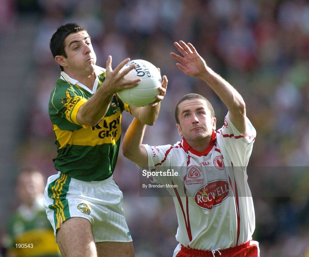 25 September 2005; Aidan O'Mahony, Kerry, in action against Stephen O'Neill, Tyrone. Bank of Ireland All-Ireland Senior Football Championship Final, Kerry v Tyrone, Croke Park, Dublin. Picture credit; Brendan Moran / SPORTSFILE *** Local Caption *** Any photograph taken by SPORTSFILE during, or in connection with, the 2005 Bank of Ireland All-Ireland Senior Football Final which displays GAA logos or contains an image or part of an image of any GAA intellectual property, or, which contains images of a GAA player/players in their playing uniforms, may only be used for editorial and non-advertising purposes.  Use of photographs for advertising, as posters or for purchase separately is strictly prohibited unless prior written approval has been obtained from the Gaelic Athletic Association.