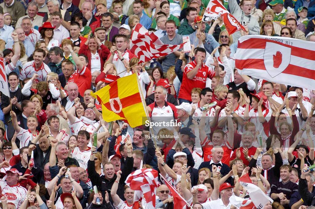 25 September 2005; Tyrone supporters celebrate Peter Canavan's first half goal. Bank of Ireland All-Ireland Senior Football Championship Final, Kerry v Tyrone, Croke Park, Dublin. Picture credit; Ray McManus / SPORTSFILE *** Local Caption *** Any photograph taken by SPORTSFILE during, or in connection with, the 2005 Bank of Ireland All-Ireland Senior Football Final which displays GAA logos or contains an image or part of an image of any GAA intellectual property, or, which contains images of a GAA player/players in their playing uniforms, may only be used for editorial and non-advertising purposes.  Use of photographs for advertising, as posters or for purchase separately is strictly prohibited unless prior written approval has been obtained from the Gaelic Athletic Association.