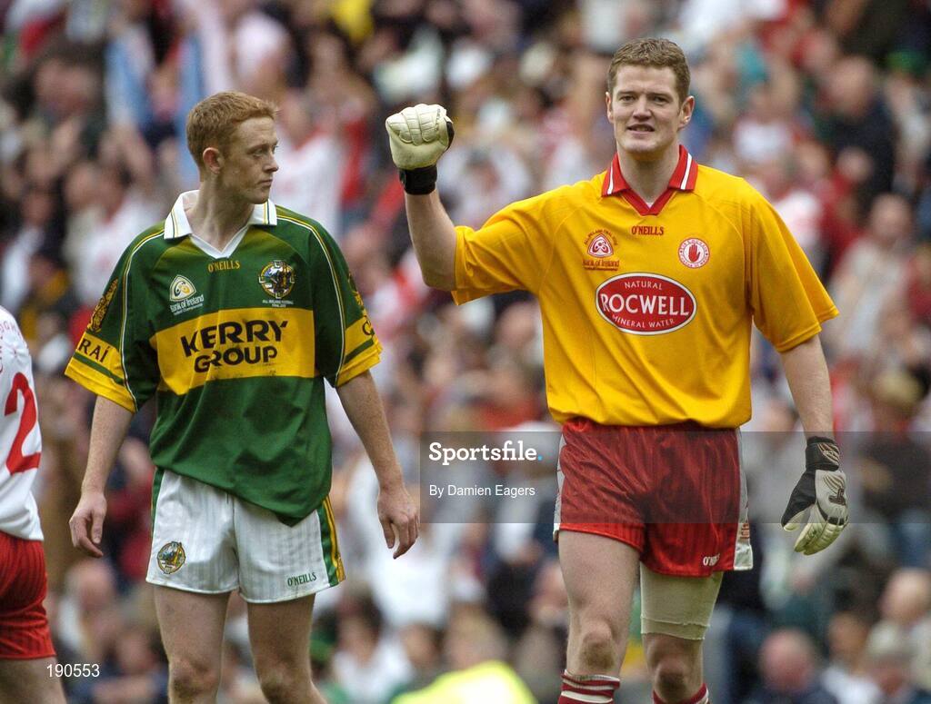 25 September 2005; Tyrone goalkeeper Pascal McConnell celebrates a Tyrone goal as Kerrys Colm Cooper looks on. Bank of Ireland All-Ireland Senior Football Championship Final, Kerry v Tyrone, Croke Park, Dublin. Picture credit; Damien Eagers/ SPORTSFILE *** Local Caption *** Any photograph taken by SPORTSFILE during, or in connection with, the 2005 Bank of Ireland All-Ireland Senior Football Final which displays GAA logos or contains an image or part of an image of any GAA intellectual property, or, which contains images of a GAA player/players in their playing uniforms, may only be used for editorial and non-advertising purposes.  Use of photographs for advertising, as posters or for purchase separately is strictly prohibited unless prior written approval has been obtained from the Gaelic Athletic Association.