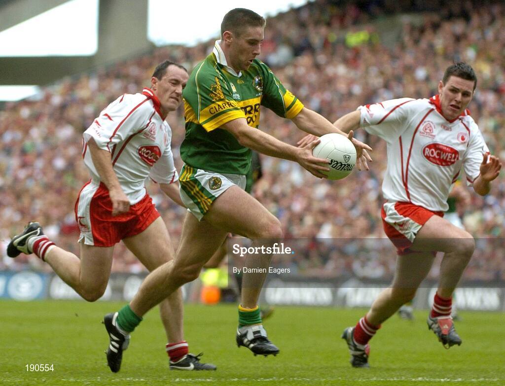 25 September 2005; Darragh O'Se, Kerry, in action against Brian Dooher, left and Conor Gormley, Tyrone. Bank of Ireland All-Ireland Senior Football Championship Final, Kerry v Tyrone, Croke Park, Dublin. Picture credit; Damien Eagers/ SPORTSFILE *** Local Caption *** Any photograph taken by SPORTSFILE during, or in connection with, the 2005 Bank of Ireland All-Ireland Senior Football Final which displays GAA logos or contains an image or part of an image of any GAA intellectual property, or, which contains images of a GAA player/players in their playing uniforms, may only be used for editorial and non-advertising purposes.  Use of photographs for advertising, as posters or for purchase separately is strictly prohibited unless prior written approval has been obtained from the Gaelic Athletic Association.