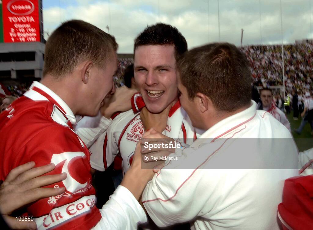 25 September 2005; Conor Gormley, Tyrone, is congratulated by supporters after the game. Bank of Ireland All-Ireland Senior Football Championship Final, Kerry v Tyrone, Croke Park, Dublin. Picture credit; Ray McManus / SPORTSFILE *** Local Caption *** Any photograph taken by SPORTSFILE during, or in connection with, the 2005 Bank of Ireland All-Ireland Senior Football Final which displays GAA logos or contains an image or part of an image of any GAA intellectual property, or, which contains images of a GAA player/players in their playing uniforms, may only be used for editorial and non-advertising purposes.  Use of photographs for advertising, as posters or for purchase separately is strictly prohibited unless prior written approval has been obtained from the Gaelic Athletic Association.
