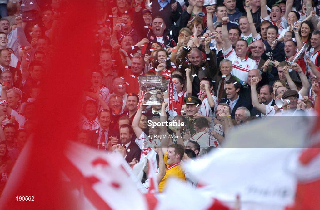 25 September 2005; Tyrone captain Brian Dooher lifts the Sam Maguire cup. Bank of Ireland All-Ireland Senior Football Championship Final, Kerry v Tyrone, Croke Park, Dublin. Picture credit; Ray McManus / SPORTSFILE *** Local Caption *** Any photograph taken by SPORTSFILE during, or in connection with, the 2005 Bank of Ireland All-Ireland Senior Football Final which displays GAA logos or contains an image or part of an image of any GAA intellectual property, or, which contains images of a GAA player/players in their playing uniforms, may only be used for editorial and non-advertising purposes.  Use of photographs for advertising, as posters or for purchase separately is strictly prohibited unless prior written approval has been obtained from the Gaelic Athletic Association.
