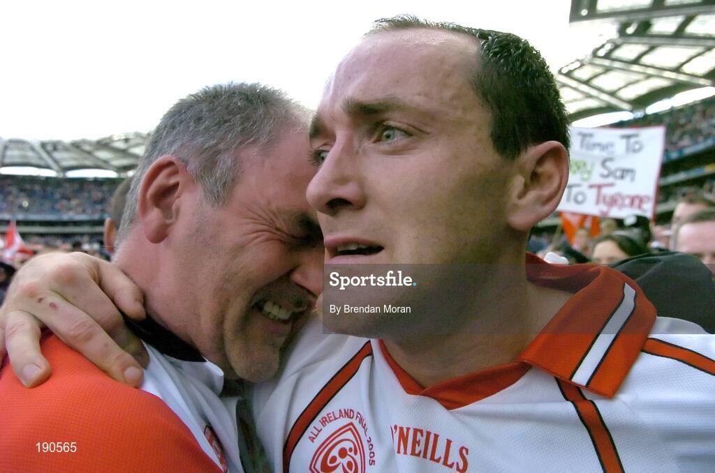 25 September 2005; Tyrone captain Brian Dooher, right, celebrates with a tearful Tyrone manager Mickey Harte. Bank of Ireland All-Ireland Senior Football Championship Final, Kerry v Tyrone, Croke Park, Dublin. Picture credit; Brendan Moran / SPORTSFILE *** Local Caption *** Any photograph taken by SPORTSFILE during, or in connection with, the 2005 Bank of Ireland All-Ireland Senior Football Final which displays GAA logos or contains an image or part of an image of any GAA intellectual property, or, which contains images of a GAA player/players in their playing uniforms, may only be used for editorial and non-advertising purposes.  Use of photographs for advertising, as posters or for purchase separately is strictly prohibited unless prior written approval has been obtained from the Gaelic Athletic Association.