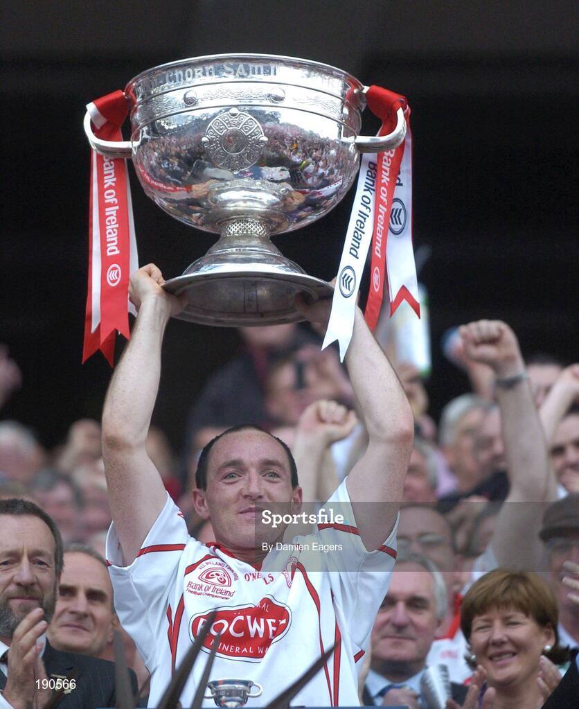 25 September 2005;Tyrone captain Brian Dooher lifts the Sam Maguire Cup. Bank of Ireland All-Ireland Senior Football Championship Final, Kerry v Tyrone, Croke Park, Dublin. Picture credit; Damien Eagers/ SPORTSFILE *** Local Caption *** Any photograph taken by SPORTSFILE during, or in connection with, the 2005 Bank of Ireland All-Ireland Senior Football Final which displays GAA logos or contains an image or part of an image of any GAA intellectual property, or, which contains images of a GAA player/players in their playing uniforms, may only be used for editorial and non-advertising purposes.  Use of photographs for advertising, as posters or for purchase separately is strictly prohibited unless prior written approval has been obtained from the Gaelic Athletic Association.