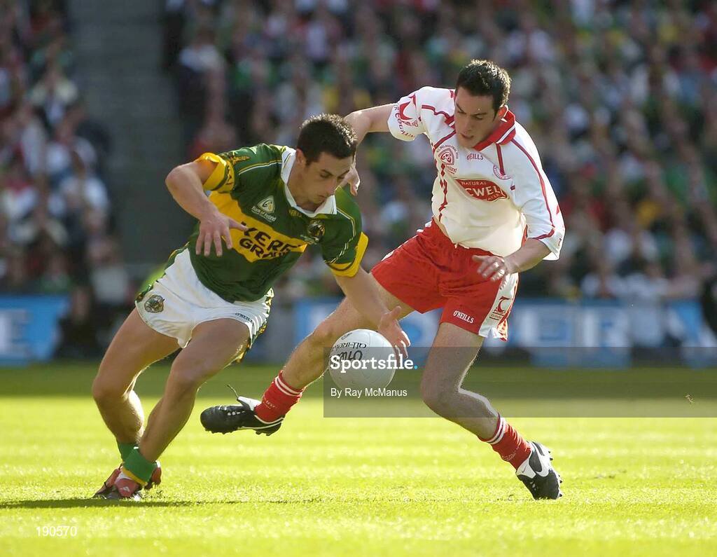 25 September 2005; Paul Galvin, Kerry, in action against Davy Harte, Tyrone. Bank of Ireland All-Ireland Senior Football Championship Final, Kerry v Tyrone, Croke Park, Dublin. Picture credit; Ray McManus / SPORTSFILE *** Local Caption *** Any photograph taken by SPORTSFILE during, or in connection with, the 2005 Bank of Ireland All-Ireland Senior Football Final which displays GAA logos or contains an image or part of an image of any GAA intellectual property, or, which contains images of a GAA player/players in their playing uniforms, may only be used for editorial and non-advertising purposes.  Use of photographs for advertising, as posters or for purchase separately is strictly prohibited unless prior written approval has been obtained from the Gaelic Athletic Association.