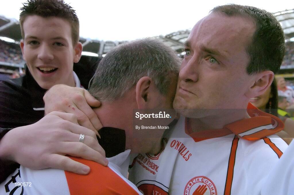 25 September 2005; Tyrone captain Brian Dooher, right, celebrates with a tearful Tyrone manager Mickey Harte. Bank of Ireland All-Ireland Senior Football Championship Final, Kerry v Tyrone, Croke Park, Dublin. Picture credit; Brendan Moran / SPORTSFILE *** Local Caption *** Any photograph taken by SPORTSFILE during, or in connection with, the 2005 Bank of Ireland All-Ireland Senior Football Final which displays GAA logos or contains an image or part of an image of any GAA intellectual property, or, which contains images of a GAA player/players in their playing uniforms, may only be used for editorial and non-advertising purposes.  Use of photographs for advertising, as posters or for purchase separately is strictly prohibited unless prior written approval has been obtained from the Gaelic Athletic Association.