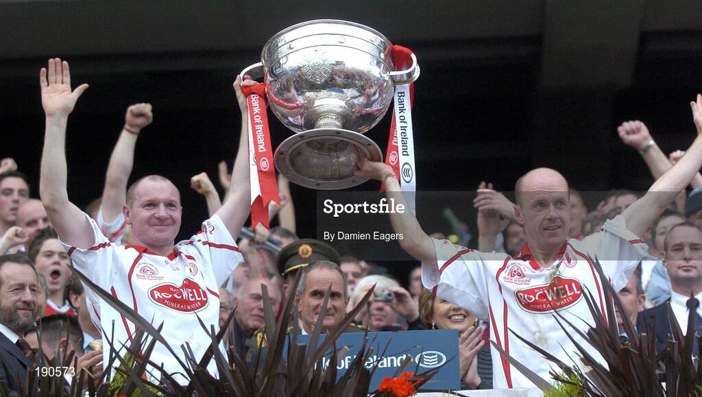 25 September 2005; Tyrone's Chris Lawn, left and Peter Canavan lift the Sam Maguire Cup. Bank of Ireland All-Ireland Senior Football Championship Final, Kerry v Tyrone, Croke Park, Dublin. Picture credit; Damien Eagers/ SPORTSFILE *** Local Caption *** Any photograph taken by SPORTSFILE during, or in connection with, the 2005 Bank of Ireland All-Ireland Senior Football Final which displays GAA logos or contains an image or part of an image of any GAA intellectual property, or, which contains images of a GAA player/players in their playing uniforms, may only be used for editorial and non-advertising purposes.  Use of photographs for advertising, as posters or for purchase separately is strictly prohibited unless prior written approval has been obtained from the Gaelic Athletic Association.