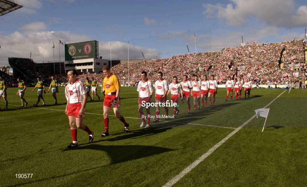 25 September 2005; The Tyrone captain leads the team during the parade. Bank of Ireland All-Ireland Senior Football Championship Final, Kerry v Tyrone, Croke Park, Dublin. Picture credit; Ray McManus / SPORTSFILE *** Local Caption *** Any photograph taken by SPORTSFILE during, or in connection with, the 2005 Bank of Ireland All-Ireland Senior Football Final which displays GAA logos or contains an image or part of an image of any GAA intellectual property, or, which contains images of a GAA player/players in their playing uniforms, may only be used for editorial and non-advertising purposes.  Use of photographs for advertising, as posters or for purchase separately is strictly prohibited unless prior written approval has been obtained from the Gaelic Athletic Association.