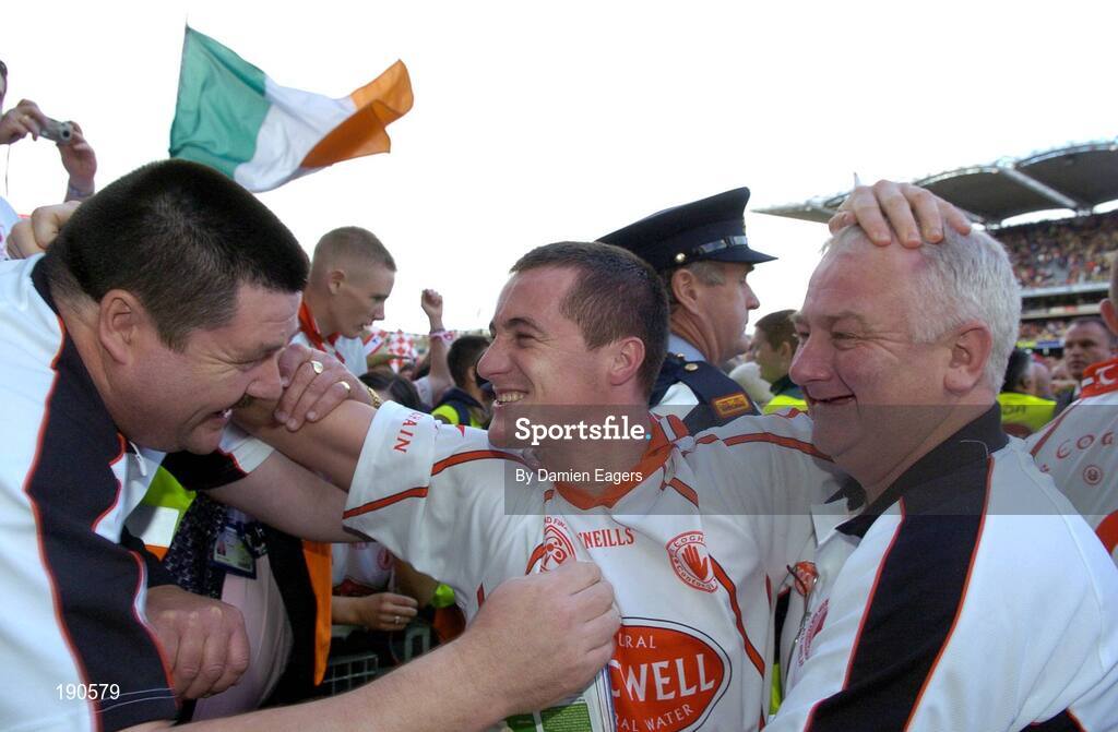 25 September 2005; Tyrone's Brian McGuigan celebrates with Jim Curran, right and Frank Goulding, after victory over Kerry. Bank of Ireland All-Ireland Senior Football Championship Final, Kerry v Tyrone, Croke Park, Dublin. Picture credit; Damien Eagers/ SPORTSFILE *** Local Caption *** Any photograph taken by SPORTSFILE during, or in connection with, the 2005 Bank of Ireland All-Ireland Senior Football Final which displays GAA logos or contains an image or part of an image of any GAA intellectual property, or, which contains images of a GAA player/players in their playing uniforms, may only be used for editorial and non-advertising purposes.  Use of photographs for advertising, as posters or for purchase separately is strictly prohibited unless prior written approval has been obtained from the Gaelic Athletic Association.