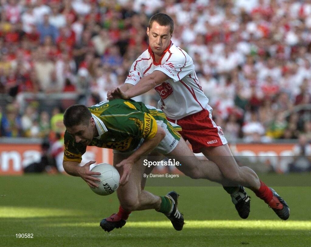 25 September 2005; Darragh O'Se, Kerry, in action against Brian McGuigan, Tyrone. Bank of Ireland All-Ireland Senior Football Championship Final, Kerry v Tyrone, Croke Park, Dublin. Picture credit; Damien Eagers/ SPORTSFILE *** Local Caption *** Any photograph taken by SPORTSFILE during, or in connection with, the 2005 Bank of Ireland All-Ireland Senior Football Final which displays GAA logos or contains an image or part of an image of any GAA intellectual property, or, which contains images of a GAA player/players in their playing uniforms, may only be used for editorial and non-advertising purposes.  Use of photographs for advertising, as posters or for purchase separately is strictly prohibited unless prior written approval has been obtained from the Gaelic Athletic Association.