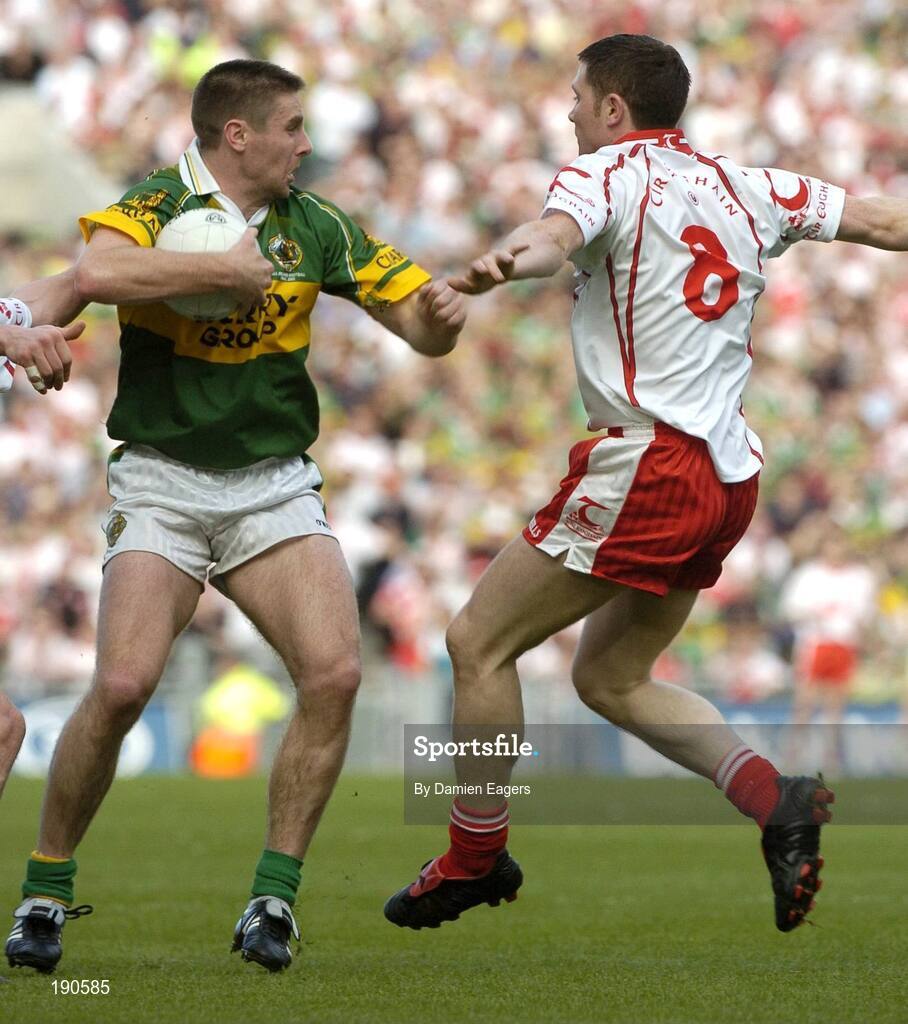 25 September 2005; Darragh O'Se, Kerry, in action against Enda McGinley, Tyrone. Bank of Ireland All-Ireland Senior Football Championship Final. Kerry v Tyrone, Croke Park, Dublin. Picture credit; Damien Eagers/ SPORTSFILE *** Local Caption *** Any photograph taken by SPORTSFILE during, or in connection with, the 2005 Bank of Ireland All-Ireland Senior Football Final which displays GAA logos or contains an image or part of an image of any GAA intellectual property, or, which contains images of a GAA player/players in their playing uniforms, may only be used for editorial and non-advertising purposes.  Use of photographs for advertising, as posters or for purchase separately is strictly prohibited unless prior written approval has been obtained from the Gaelic Athletic Association.