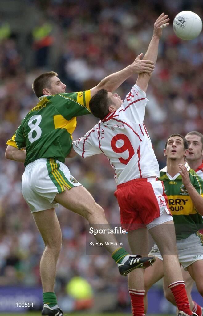 25 September 2005; Sean Cavanagh, Tyrone, in action against Darragh O Se, Kerry. Bank of Ireland All-Ireland Senior Football Championship Final, Kerry v Tyrone, Croke Park, Dublin. Picture credit; Ray McManus / SPORTSFILE *** Local Caption *** Any photograph taken by SPORTSFILE during, or in connection with, the 2005 Bank of Ireland All-Ireland Senior Football Final which displays GAA logos or contains an image or part of an image of any GAA intellectual property, or, which contains images of a GAA player/players in their playing uniforms, may only be used for editorial and non-advertising purposes.  Use of photographs for advertising, as posters or for purchase separately is strictly prohibited unless prior written approval has been obtained from the Gaelic Athletic Association.