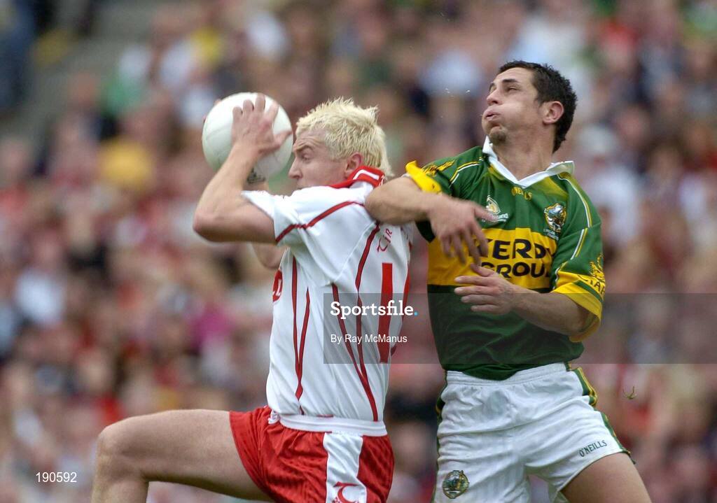 25 September 2005; Owen Mulligan, Tyrone, in action against Paul Galvin, Kerry. Bank of Ireland All-Ireland Senior Football Championship Final, Kerry v Tyrone, Croke Park, Dublin. Picture credit; Ray McManus / SPORTSFILE *** Local Caption *** Any photograph taken by SPORTSFILE during, or in connection with, the 2005 Bank of Ireland All-Ireland Senior Football Final which displays GAA logos or contains an image or part of an image of any GAA intellectual property, or, which contains images of a GAA player/players in their playing uniforms, may only be used for editorial and non-advertising purposes.  Use of photographs for advertising, as posters or for purchase separately is strictly prohibited unless prior written approval has been obtained from the Gaelic Athletic Association.