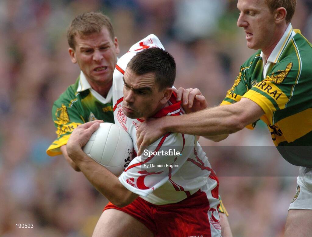 25 September 2005; Ryan McMenamin, Tyrone, in action against Dara O'Cinneide, left and Liam Hassett, Kerry, Bank of Ireland All-Ireland Senior Football Championship Final, Kerry v Tyrone, Croke Park, Dublin. Picture credit; Damien Eagers/ SPORTSFILE *** Local Caption *** Any photograph taken by SPORTSFILE during, or in connection with, the 2005 Bank of Ireland All-Ireland Senior Football Final which displays GAA logos or contains an image or part of an image of any GAA intellectual property, or, which contains images of a GAA player/players in their playing uniforms, may only be used for editorial and non-advertising purposes.  Use of photographs for advertising, as posters or for purchase separately is strictly prohibited unless prior written approval has been obtained from the Gaelic Athletic Association.