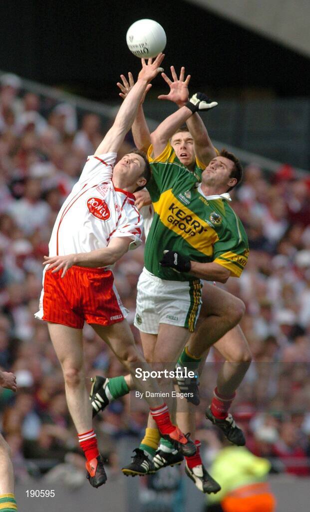 25 September 2005; Enda McGinley, Tyrone contests a high ball with Kerry's Darragh O'Se, (back) and William Kirby. Bank of Ireland All-Ireland Senior Football Championship Final, Kerry v Tyrone, Croke Park, Dublin. Picture credit; Damien Eagers/ SPORTSFILE *** Local Caption *** Any photograph taken by SPORTSFILE during, or in connection with, the 2005 Bank of Ireland All-Ireland Senior Football Final which displays GAA logos or contains an image or part of an image of any GAA intellectual property, or, which contains images of a GAA player/players in their playing uniforms, may only be used for editorial and non-advertising purposes.  Use of photographs for advertising, as posters or for purchase separately is strictly prohibited unless prior written approval has been obtained from the Gaelic Athletic Association.