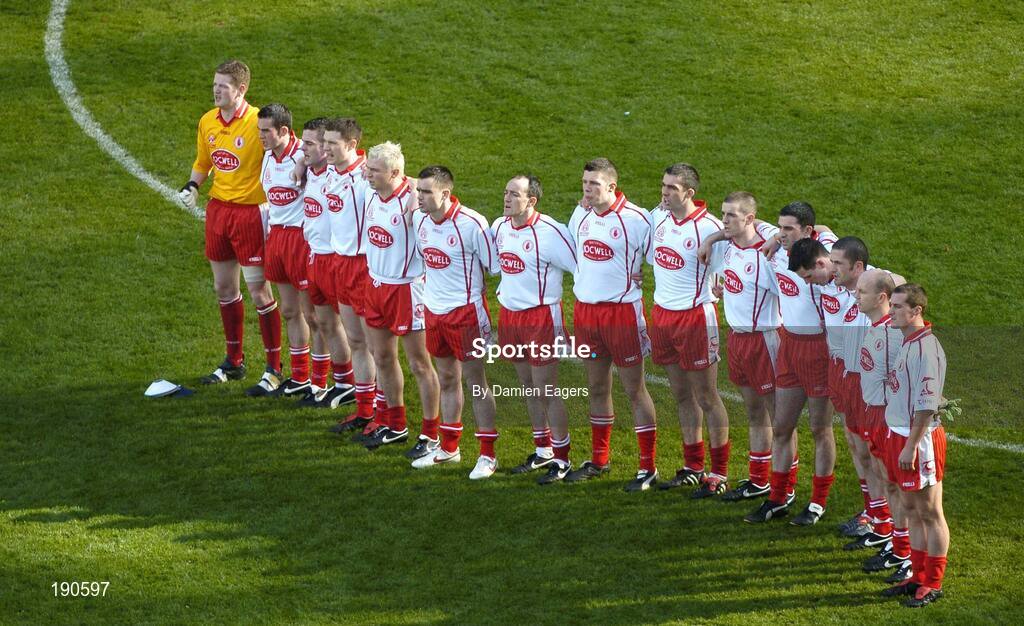 25 September 2005; The Tyrone team stand for the national anthem. Bank of Ireland All-Ireland Senior Football Championship Final, Kerry v Tyrone, Croke Park, Dublin. Picture credit; Damien Eagers/ SPORTSFILE *** Local Caption *** Any photograph taken by SPORTSFILE during, or in connection with, the 2005 Bank of Ireland All-Ireland Senior Football Final which displays GAA logos or contains an image or part of an image of any GAA intellectual property, or, which contains images of a GAA player/players in their playing uniforms, may only be used for editorial and non-advertising purposes.  Use of photographs for advertising, as posters or for purchase separately is strictly prohibited unless prior written approval has been obtained from the Gaelic Athletic Association.