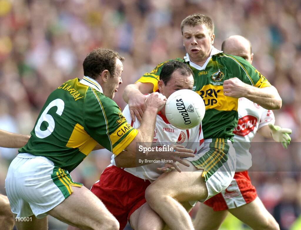 25 September 2005; Brian Dooher, Tyrone, in action against Seamus Moynihan (6) and Tomas O Se, Kerry. Bank of Ireland All-Ireland Senior Football Championship Final, Kerry v Tyrone, Croke Park, Dublin. Picture credit; Brendan Moran / SPORTSFILE *** Local Caption *** Any photograph taken by SPORTSFILE during, or in connection with, the 2005 Bank of Ireland All-Ireland Senior Football Final which displays GAA logos or contains an image or part of an image of any GAA intellectual property, or, which contains images of a GAA player/players in their playing uniforms, may only be used for editorial and non-advertising purposes.  Use of photographs for advertising, as posters or for purchase separately is strictly prohibited unless prior written approval has been obtained from the Gaelic Athletic Association.