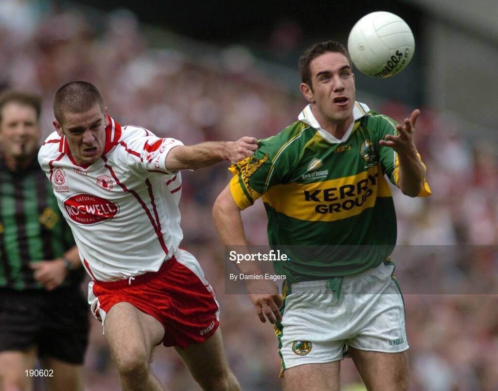 25 September 2005; Declan O'Sullivan, Kerry, in action against Philip Jordan, Tyrone. Bank of Ireland All-Ireland Senior Football Championship Final, Kerry v Tyrone, Croke Park, Dublin. Picture credit; Damien Eagers/ SPORTSFILE *** Local Caption *** Any photograph taken by SPORTSFILE during, or in connection with, the 2005 Bank of Ireland All-Ireland Senior Football Final which displays GAA logos or contains an image or part of an image of any GAA intellectual property, or, which contains images of a GAA player/players in their playing uniforms, may only be used for editorial and non-advertising purposes.  Use of photographs for advertising, as posters or for purchase separately is strictly prohibited unless prior written approval has been obtained from the Gaelic Athletic Association.