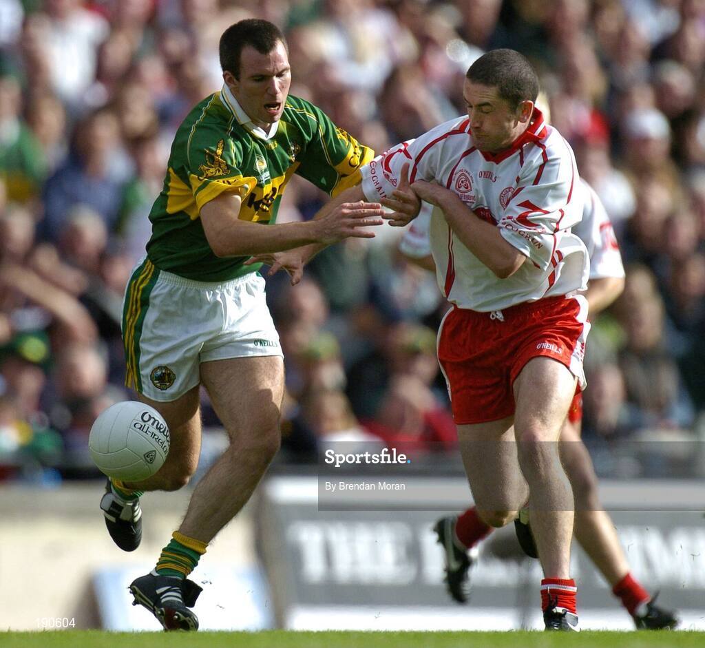25 September 2005; Stephen O'Neill, Tyrone, in action against Michael McCarthy, Kerry. Bank of Ireland All-Ireland Senior Football Championship Final, Kerry v Tyrone, Croke Park, Dublin. Picture credit; Brendan Moran / SPORTSFILE *** Local Caption *** Any photograph taken by SPORTSFILE during, or in connection with, the 2005 Bank of Ireland All-Ireland Senior Football Final which displays GAA logos or contains an image or part of an image of any GAA intellectual property, or, which contains images of a GAA player/players in their playing uniforms, may only be used for editorial and non-advertising purposes.  Use of photographs for advertising, as posters or for purchase separately is strictly prohibited unless prior written approval has been obtained from the Gaelic Athletic Association.