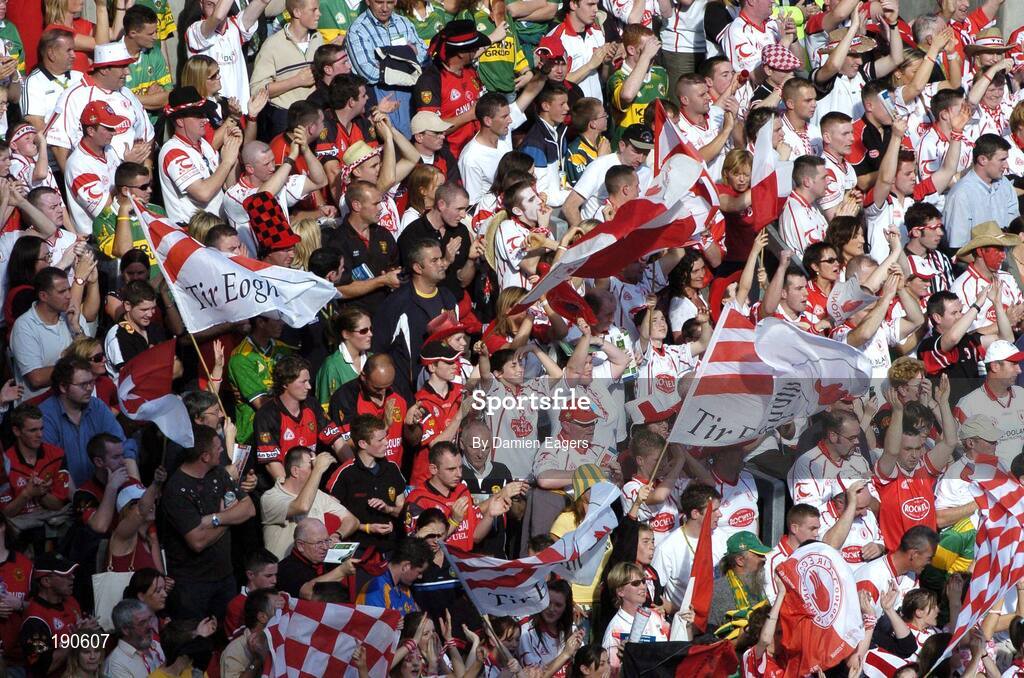 25 September 2005; Tyrone supporters cheer on their team. Bank of Ireland All-Ireland Senior Football Championship Final, Kerry v Tyrone, Croke Park, Dublin. Picture credit; Damien Eagers/ SPORTSFILE *** Local Caption *** Any photograph taken by SPORTSFILE during, or in connection with, the 2005 Bank of Ireland All-Ireland Senior Football Final which displays GAA logos or contains an image or part of an image of any GAA intellectual property, or, which contains images of a GAA player/players in their playing uniforms, may only be used for editorial and non-advertising purposes.  Use of photographs for advertising, as posters or for purchase separately is strictly prohibited unless prior written approval has been obtained from the Gaelic Athletic Association.