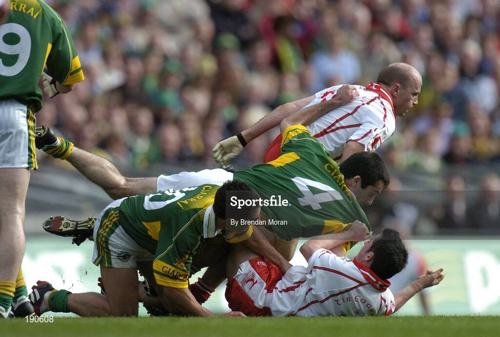 25 September 2005; Peter Canavan and Davy Harte, Tyrone, get involved in an altercation with Paul Galvin and Tom O'Sullivan (4), Kerry. Bank of Ireland All-Ireland Senior Football Championship Final, Kerry v Tyrone, Croke Park, Dublin. Picture credit; Brendan Moran / SPORTSFILE *** Local Caption *** Any photograph taken by SPORTSFILE during, or in connection with, the 2005 Bank of Ireland All-Ireland Senior Football Final which displays GAA logos or contains an image or part of an image of any GAA intellectual property, or, which contains images of a GAA player/players in their playing uniforms, may only be used for editorial and non-advertising purposes.  Use of photographs for advertising, as posters or for purchase separately is strictly prohibited unless prior written approval has been obtained from the Gaelic Athletic Association.