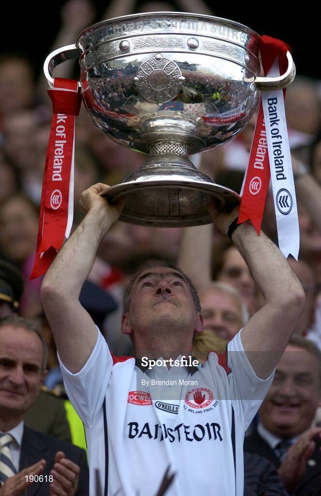 25 September 2005; Tyrone manager Mickey Harte lifts the Sam Maguire Cup after the game. Bank of Ireland All-Ireland Senior Football Championship Final, Kerry v Tyrone, Croke Park, Dublin. Picture credit; Brendan Moran / SPORTSFILE *** Local Caption *** Any photograph taken by SPORTSFILE during, or in connection with, the 2005 Bank of Ireland All-Ireland Senior Football Final which displays GAA logos or contains an image or part of an image of any GAA intellectual property, or, which contains images of a GAA player/players in their playing uniforms, may only be used for editorial and non-advertising purposes.  Use of photographs for advertising, as posters or for purchase separately is strictly prohibited unless prior written approval has been obtained from the Gaelic Athletic Association.