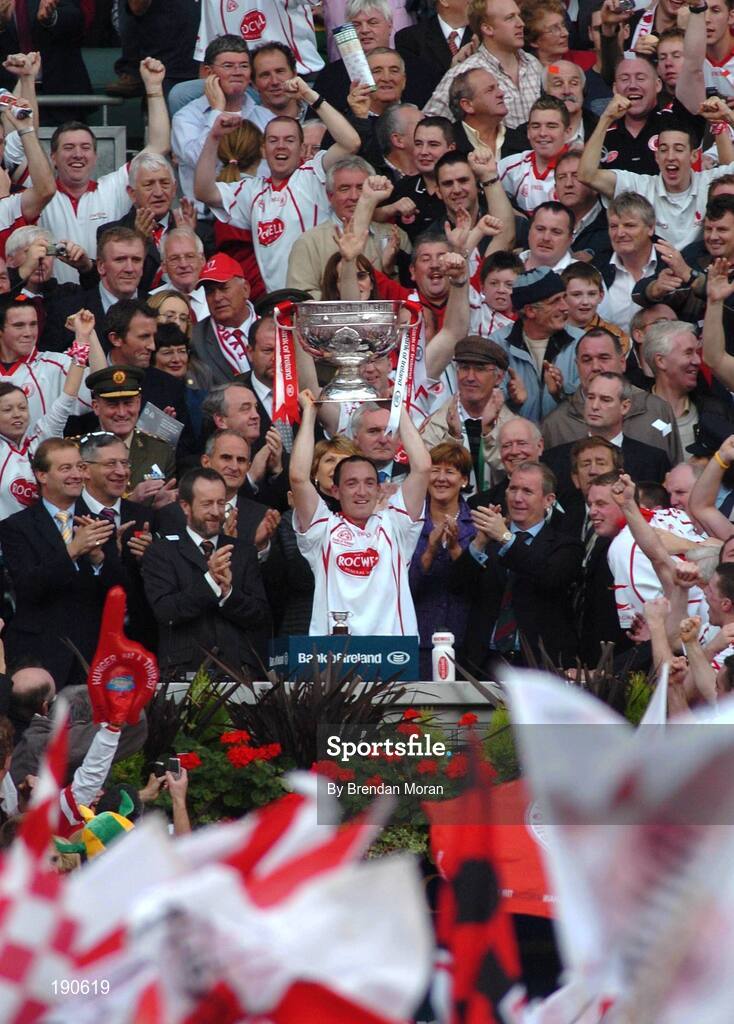 25 September 2005; Tyrone captain Brian Dooher lifts the Sam Maguire Cup after the game. Bank of Ireland All-Ireland Senior Football Championship Final, Kerry v Tyrone, Croke Park, Dublin. Picture credit; Brendan Moran / SPORTSFILE *** Local Caption *** Any photograph taken by SPORTSFILE during, or in connection with, the 2005 Bank of Ireland All-Ireland Senior Football Final which displays GAA logos or contains an image or part of an image of any GAA intellectual property, or, which contains images of a GAA player/players in their playing uniforms, may only be used for editorial and non-advertising purposes.  Use of photographs for advertising, as posters or for purchase separately is strictly prohibited unless prior written approval has been obtained from the Gaelic Athletic Association.