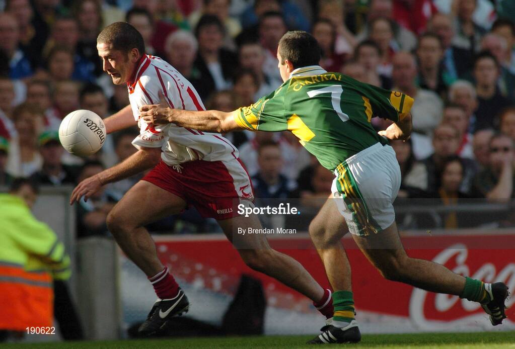 25 September 2005; Stephen O'Neill, Tyrone, in action against Aidan O'Mahony, Kerry. Bank of Ireland All-Ireland Senior Football Championship Final, Kerry v Tyrone, Croke Park, Dublin. Picture credit; Brendan Moran / SPORTSFILE *** Local Caption *** Any photograph taken by SPORTSFILE during, or in connection with, the 2005 Bank of Ireland All-Ireland Senior Football Final which displays GAA logos or contains an image or part of an image of any GAA intellectual property, or, which contains images of a GAA player/players in their playing uniforms, may only be used for editorial and non-advertising purposes.  Use of photographs for advertising, as posters or for purchase separately is strictly prohibited unless prior written approval has been obtained from the Gaelic Athletic Association.