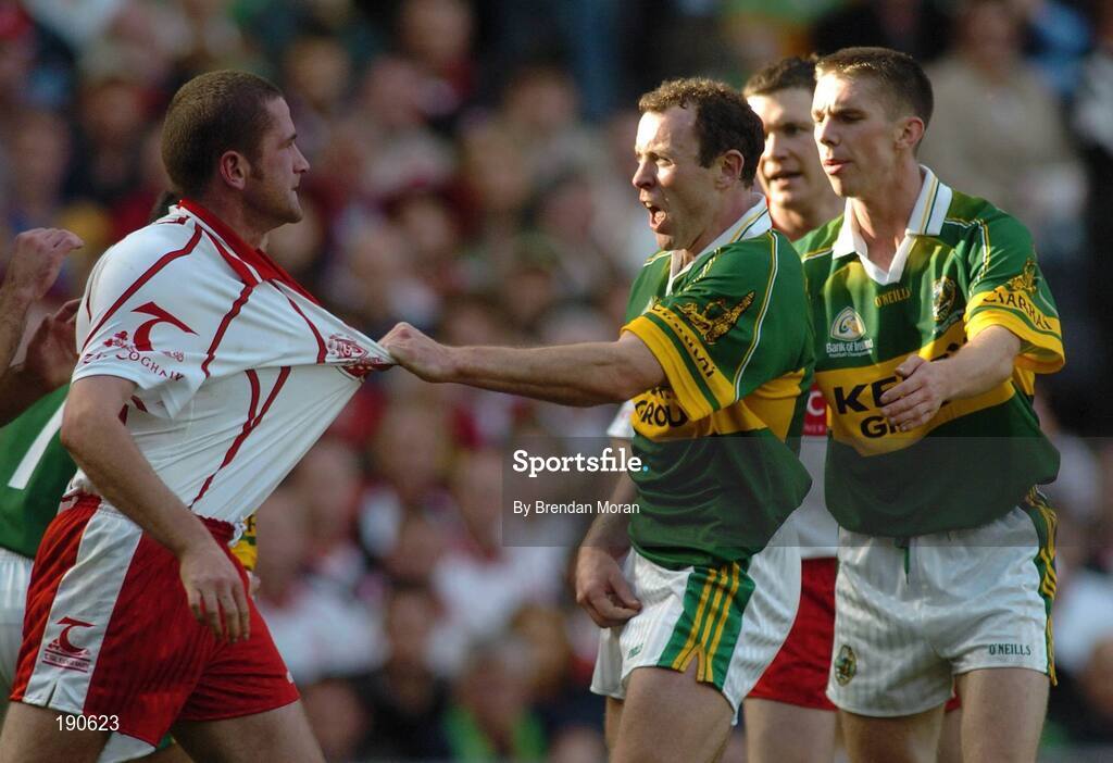 25 September 2005; Stephen O'Neill, Tyrone, in a tussle with Seamus Moynihan, Kerry. Bank of Ireland All-Ireland Senior Football Championship Final, Kerry v Tyrone, Croke Park, Dublin. Picture credit; Brendan Moran / SPORTSFILE *** Local Caption *** Any photograph taken by SPORTSFILE during, or in connection with, the 2005 Bank of Ireland All-Ireland Senior Football Final which displays GAA logos or contains an image or part of an image of any GAA intellectual property, or, which contains images of a GAA player/players in their playing uniforms, may only be used for editorial and non-advertising purposes.  Use of photographs for advertising, as posters or for purchase separately is strictly prohibited unless prior written approval has been obtained from the Gaelic Athletic Association.
