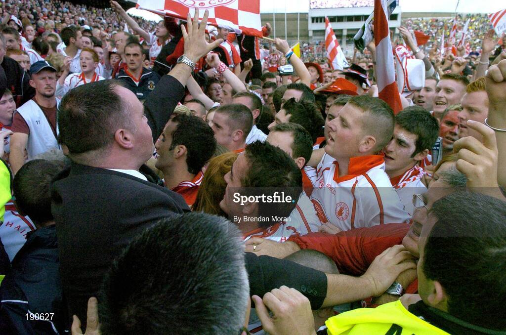 25 September 2005; Security personnel urge the crowd to keep back from the presentation area. Bank of Ireland All-Ireland Senior Football Championship Final, Kerry v Tyrone, Croke Park, Dublin. Picture credit; Brendan Moran / SPORTSFILE *** Local Caption *** Any photograph taken by SPORTSFILE during, or in connection with, the 2005 Bank of Ireland All-Ireland Senior Football Final which displays GAA logos or contains an image or part of an image of any GAA intellectual property, or, which contains images of a GAA player/players in their playing uniforms, may only be used for editorial and non-advertising purposes.  Use of photographs for advertising, as posters or for purchase separately is strictly prohibited unless prior written approval has been obtained from the Gaelic Athletic Association.
