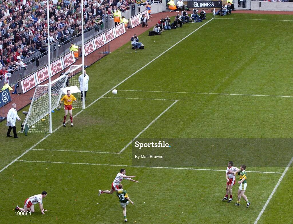 25 September 2005; Colm Cooper (13), Kerry, kicks a point against Tyrone. Bank of Ireland All-Ireland Senior Football Championship Final, Kerry v Tyrone, Croke Park, Dublin. Picture credit; Matt Browne / SPORTSFILE *** Local Caption *** Any photograph taken by SPORTSFILE during, or in connection with, the 2005 Bank of Ireland All-Ireland Senior Football Final which displays GAA logos or contains an image or part of an image of any GAA intellectual property, or, which contains images of a GAA player/players in their playing uniforms, may only be used for editorial and non-advertising purposes.  Use of photographs for advertising, as posters or for purchase separately is strictly prohibited unless prior written approval has been obtained from the Gaelic Athletic Association.