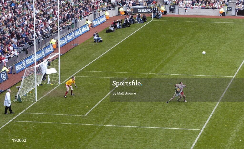 25 September 2005; Colm Cooper, Kerry, contests a dropping ball with Ryan McMenamin, Tyrone. Bank of Ireland All-Ireland Senior Football Championship Final, Kerry v Tyrone, Croke Park, Dublin. Picture credit; Matt Browne / SPORTSFILE *** Local Caption *** Any photograph taken by SPORTSFILE during, or in connection with, the 2005 Bank of Ireland All-Ireland Senior Football Final which displays GAA logos or contains an image or part of an image of any GAA intellectual property, or, which contains images of a GAA player/players in their playing uniforms, may only be used for editorial and non-advertising purposes.  Use of photographs for advertising, as posters or for purchase separately is strictly prohibited unless prior written approval has been obtained from the Gaelic Athletic Association.
