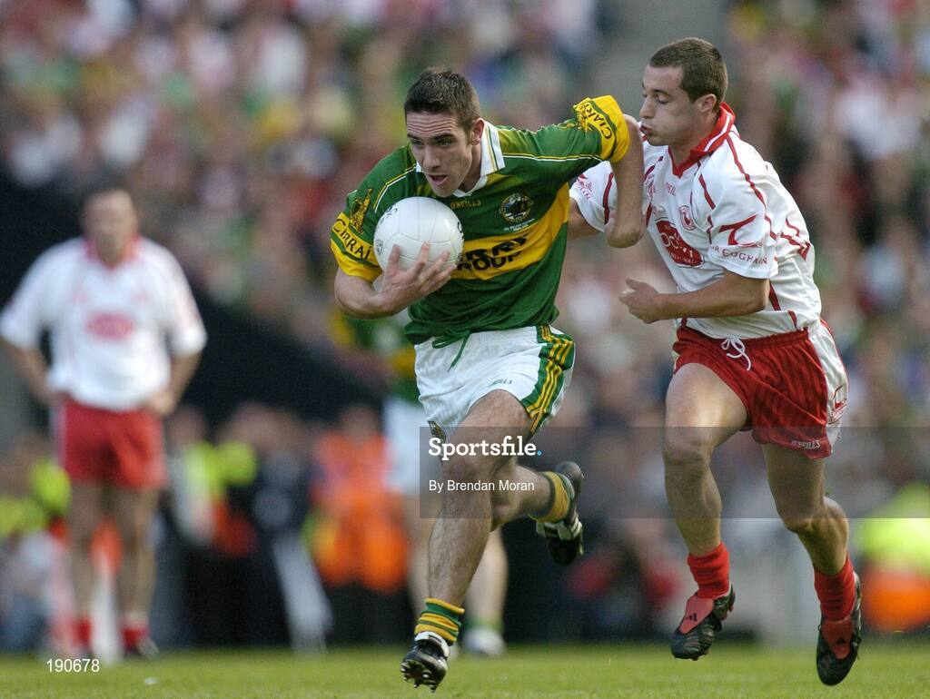 25 September 2005; Declan O'Sullivan, Kerry, in action against Brian McGuigan, Tyrone. Bank of Ireland All-Ireland Senior Football Championship Final, Kerry v Tyrone, Croke Park, Dublin. Picture credit; Brendan Moran / SPORTSFILE *** Local Caption *** Any photograph taken by SPORTSFILE during, or in connection with, the 2005 Bank of Ireland All-Ireland Senior Football Final which displays GAA logos or contains an image or part of an image of any GAA intellectual property, or, which contains images of a GAA player/players in their playing uniforms, may only be used for editorial and non-advertising purposes.  Use of photographs for advertising, as posters or for purchase separately is strictly prohibited unless prior written approval has been obtained from the Gaelic Athletic Association.