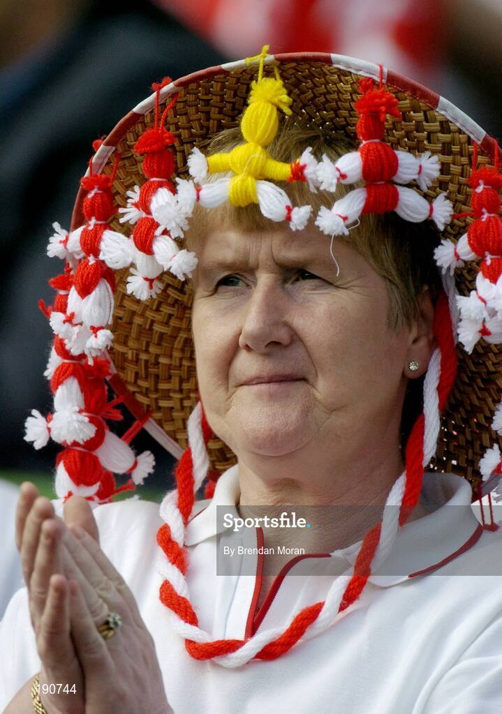 25 September 2005; A Tyrone fan cheers on her side during the game. Bank of Ireland All-Ireland Senior Football Championship Final, Kerry v Tyrone, Croke Park, Dublin. Picture credit; Brendan Moran / SPORTSFILE *** Local Caption *** Any photograph taken by SPORTSFILE during, or in connection with, the 2005 Bank of Ireland All-Ireland Senior Football Final which displays GAA logos or contains an image or part of an image of any GAA intellectual property, or, which contains images of a GAA player/players in their playing uniforms, may only be used for editorial and non-advertising purposes.  Use of photographs for advertising, as posters or for purchase separately is strictly prohibited unless prior written approval has been obtained from the Gaelic Athletic Association.