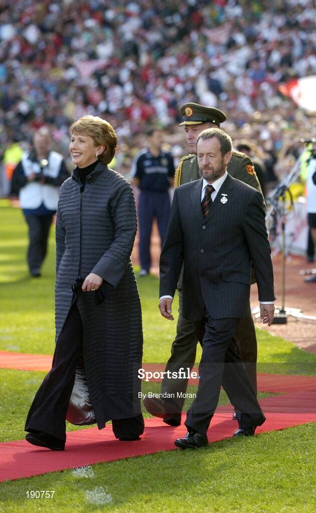 25 September 2005; President Mary McAleese, accompanied by Sean Kelly, President of the GAA, makes her way to meet the teams before the game. Bank of Ireland All-Ireland Senior Football Championship Final, Kerry v Tyrone, Croke Park, Dublin. Picture credit; Brendan Moran / SPORTSFILE *** Local Caption *** Any photograph taken by SPORTSFILE during, or in connection with, the 2005 Bank of Ireland All-Ireland Senior Football Final which displays GAA logos or contains an image or part of an image of any GAA intellectual property, or, which contains images of a GAA player/players in their playing uniforms, may only be used for editorial and non-advertising purposes.  Use of photographs for advertising, as posters or for purchase separately is strictly prohibited unless prior written approval has been obtained from the Gaelic Athletic Association.